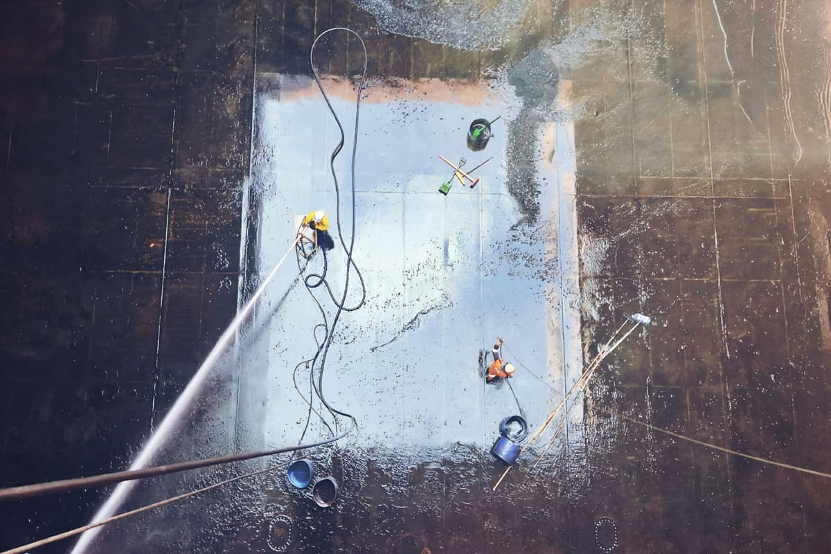 A gravel vacuum siphon cleaning aquarium substrate